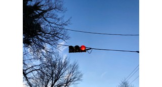 Horizontal stoplight showing red.